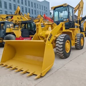 Used CAT 938 Wheel Loader with bucket, ready for construction use