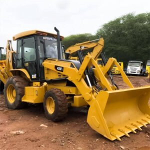 Used CAT 420F backhoe loader working on-site with front and back attachments visible