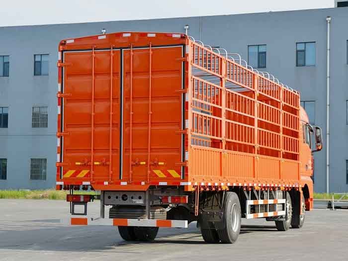 Rear view of SITRAK G7 6X2 truck with open fence cargo body