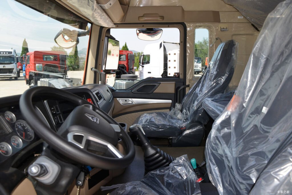 Close-up of HOWO TX 400HP 4X2 tractor truck cabin showing high-roof and ergonomic design.