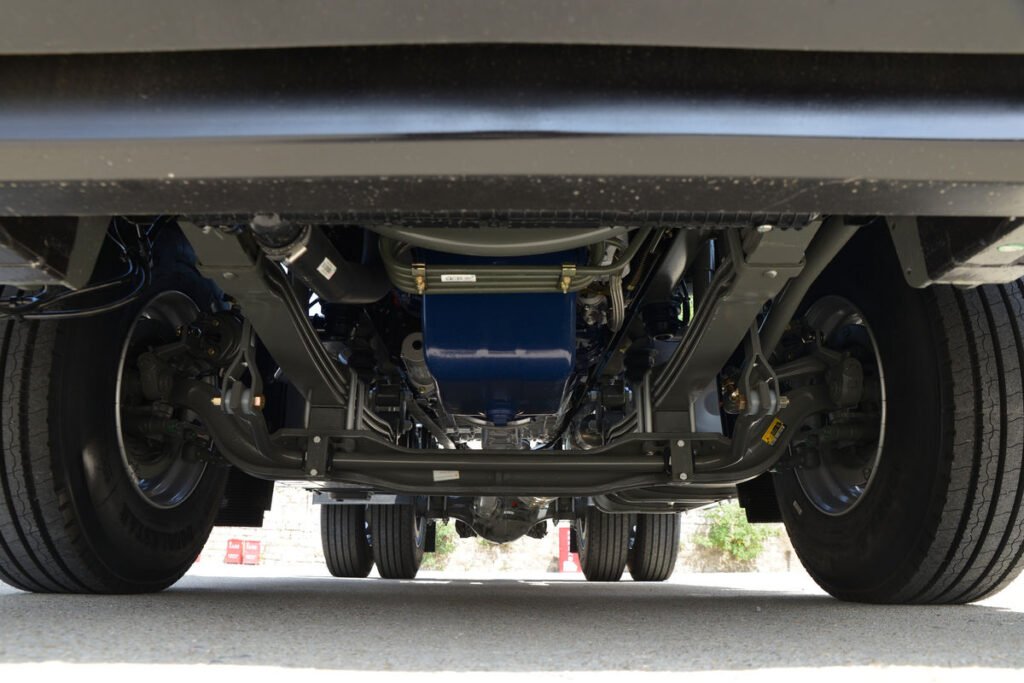 Underbody of HOWO TX 400HP 4X2 tractor truck featuring chassis and suspension system.