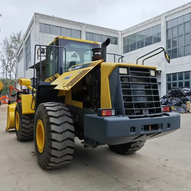 Front view of a used Komatsu loader showing durable build and operator cab close-up