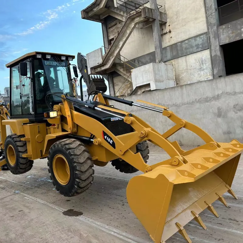 Used CAT 416E Backhoe Loader in three-quarter view showing front loader and rear backhoe