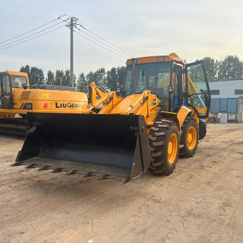 Front view of used JCB 4CX backhoe loader with cab and loader arm