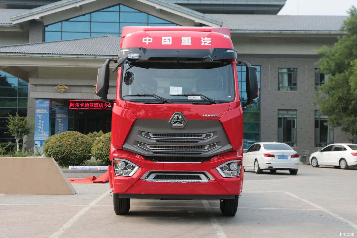 Front view of 400HP 6x4 heavy-duty truck featuring detailed grille and headlights.