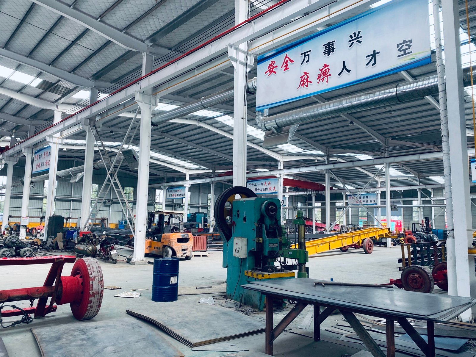 Factory interior of ZW Group showing truck assembly and repair area