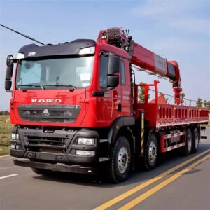 Howo TX 350hp 8x4 truck crane front side view with hydraulic lifting arm and heavy-duty chassis