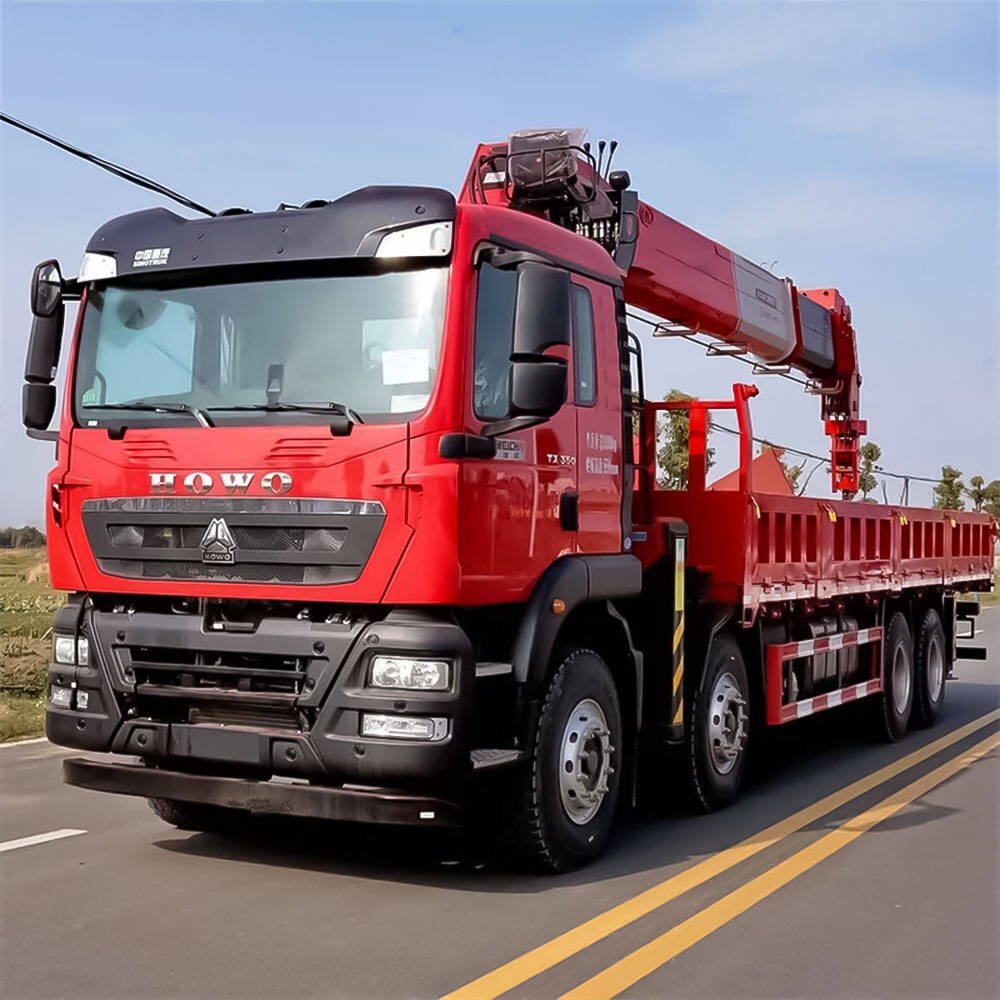 Howo TX 350hp 8x4 truck crane front side view with hydraulic lifting arm and heavy-duty chassis