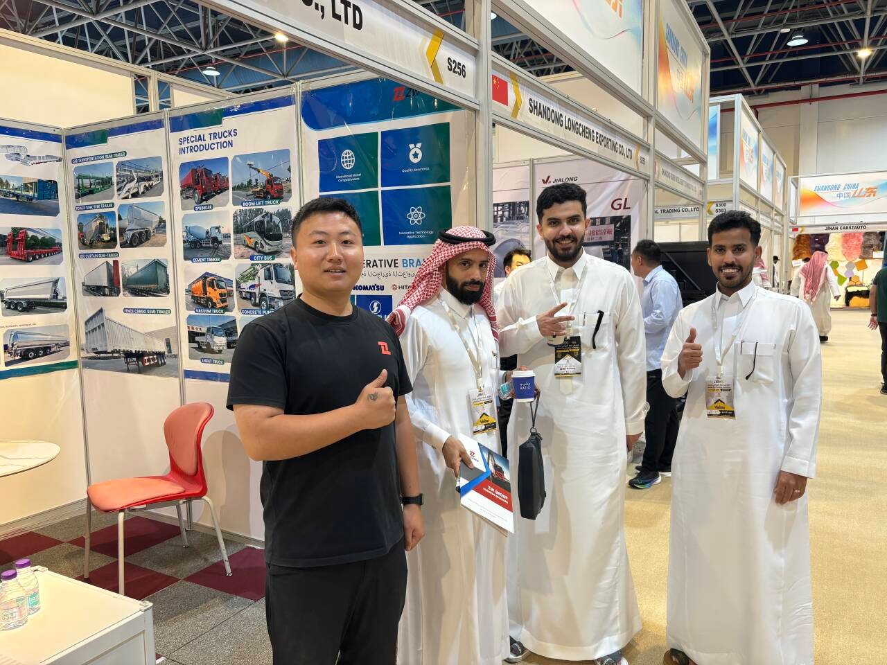 ZW Group booth at Saudi Arabia exhibition showing HOWO trucks