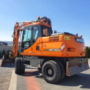 Used Doosan DX140W wheeled excavator with bucket fully extended on construction site