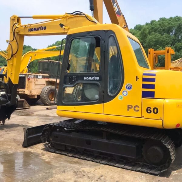 Used Komatsu PC60-7 excavator side profile with digging bucket and hydraulic arm visible