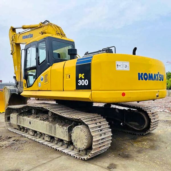 Used Komatsu PC300-7 Excavator with boom extended on construction site
