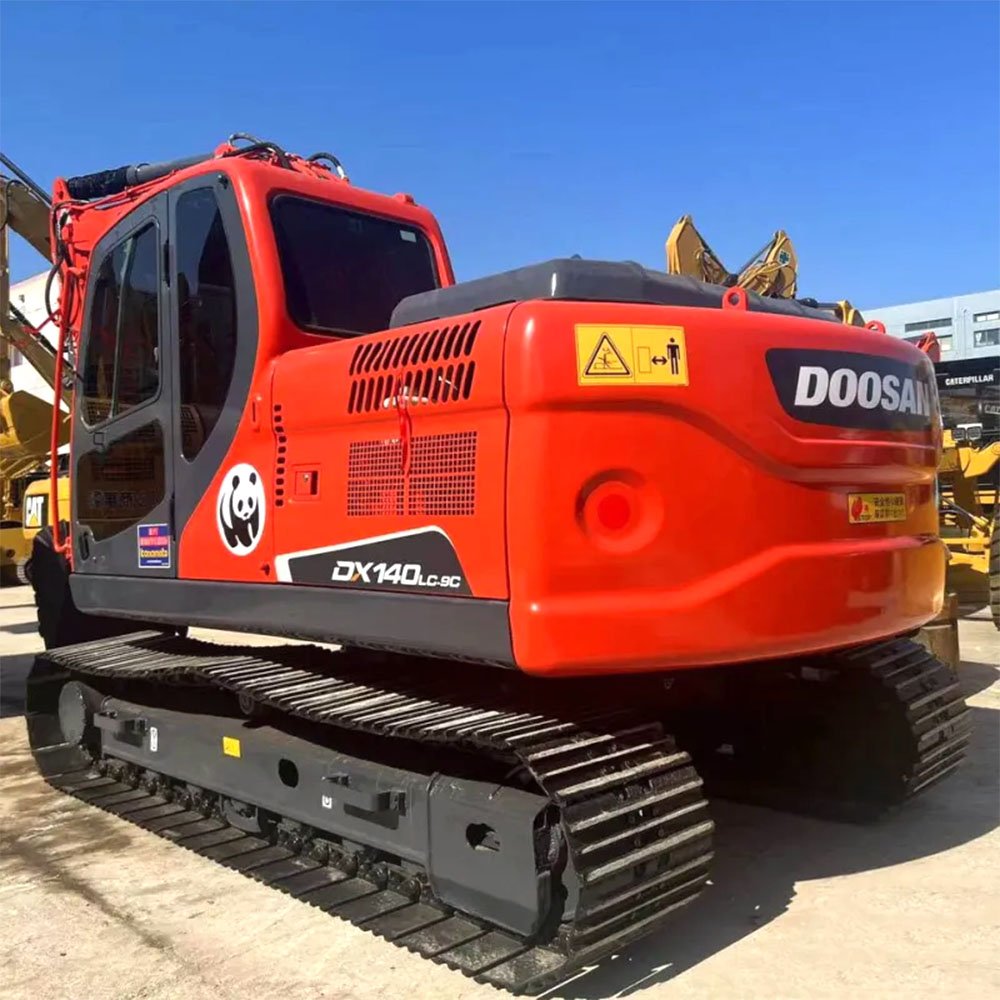 Used Doosan DX140 hydraulic excavator side view with boom fully extended on construction site