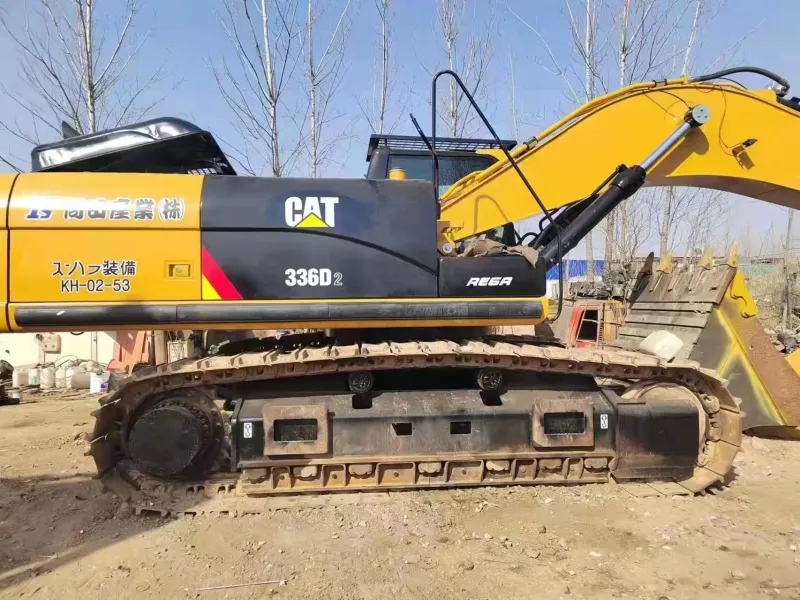 Side view of CAT 336D excavator showing boom and undercarriage