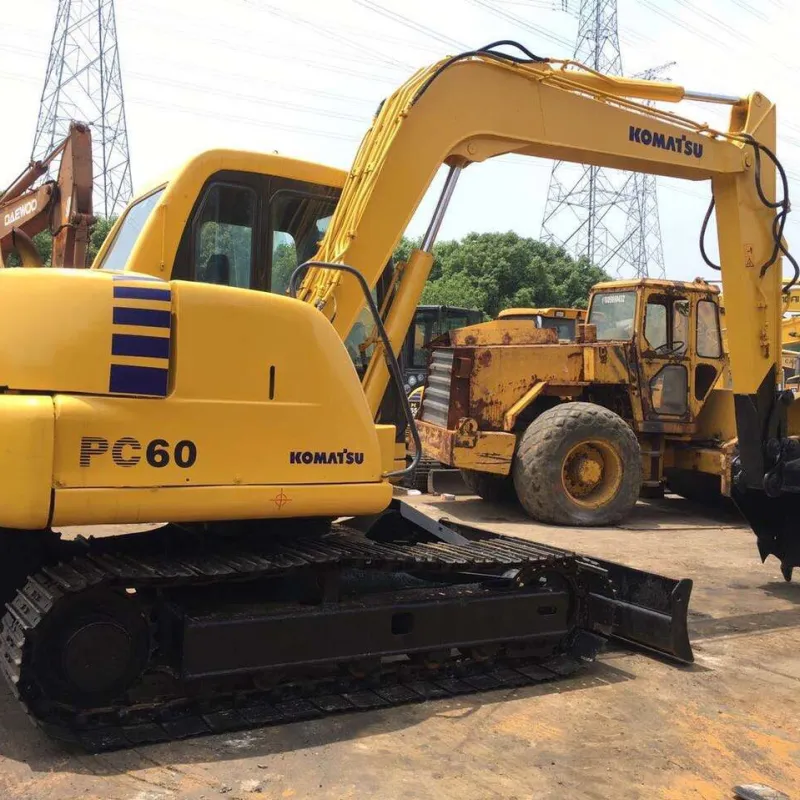 Komatsu PC60-7 excavator full front-side view with cab, bucket, and track system