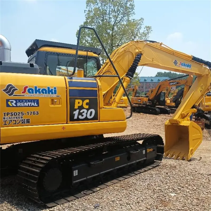 Used Komatsu PC130 excavator side profile with arm and bucket fully extended