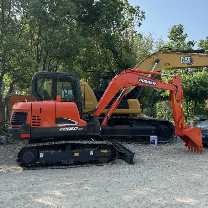 Side view of Doosan DX60 Excavator with boom fully extended, showing hydraulic arm and tracks