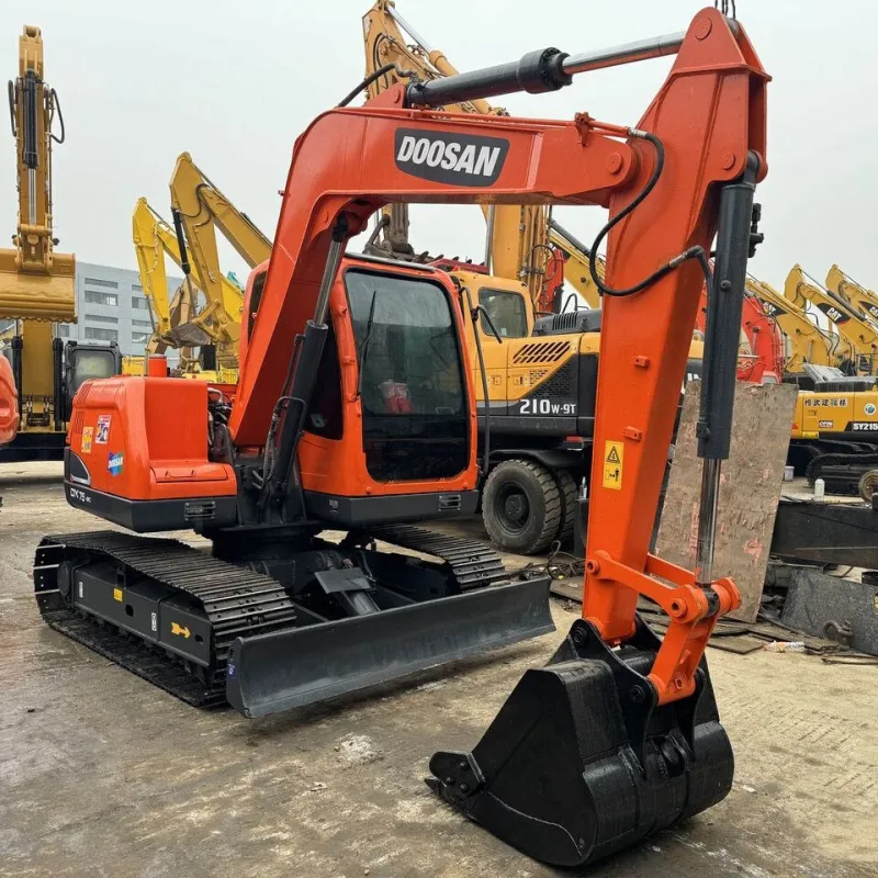 Three-quarter angle of Doosan DX75 excavator with boom fully extended, highlighting operator cabin and arm reach