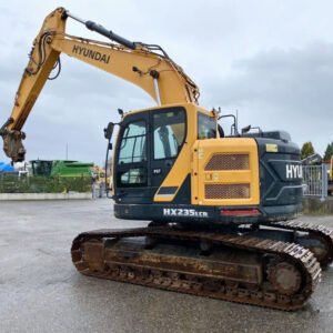 Used Hyundai 235 crawler excavator side view with bucket lowered