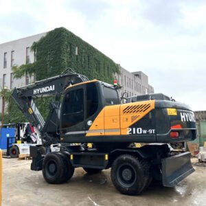 Used Hyundai 210W wheeled excavator side profile with bucket raised