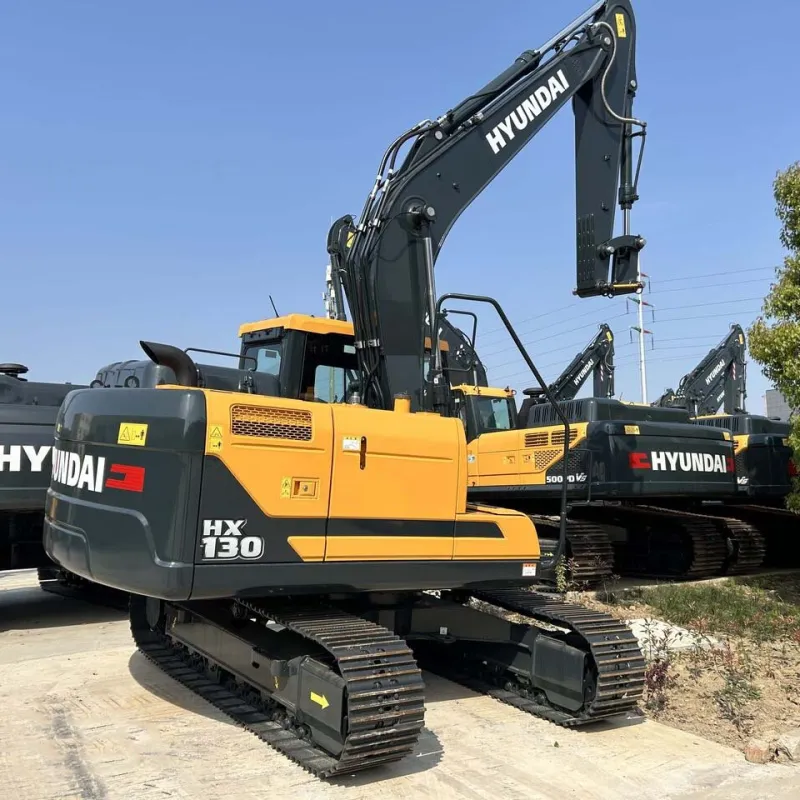 Used Hyundai 130 Excavator showing side view with boom and bucket fully extended on construction site