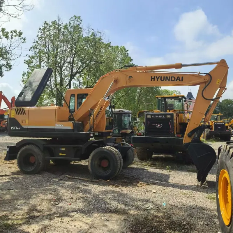 Side view of Hyundai 150W excavator with boom and bucket fully extended