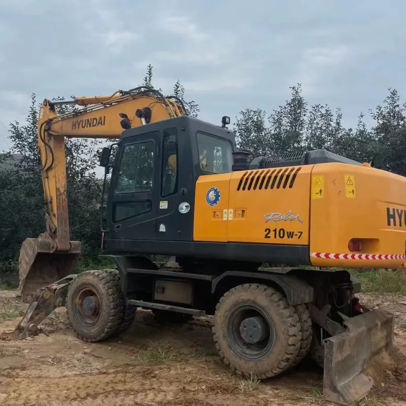 3/4 angle of Hyundai 210W excavator with boom extended in operation