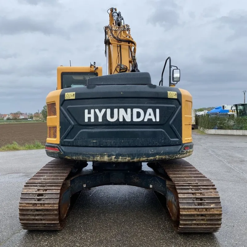 Rear profile of Hyundai 235 used excavator showing counterweight and engine housing