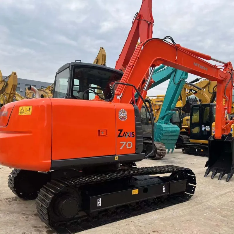 Used Hitachi EX70 ZX70 Excavator 3/4 angle with boom extended, showing hydraulic arm and versatile operation