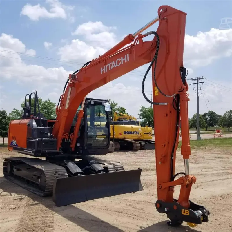 Used Hitachi EX130 ZX130 Excavator in three-quarter view with boom fully extended, showing digging range and hydraulic precision