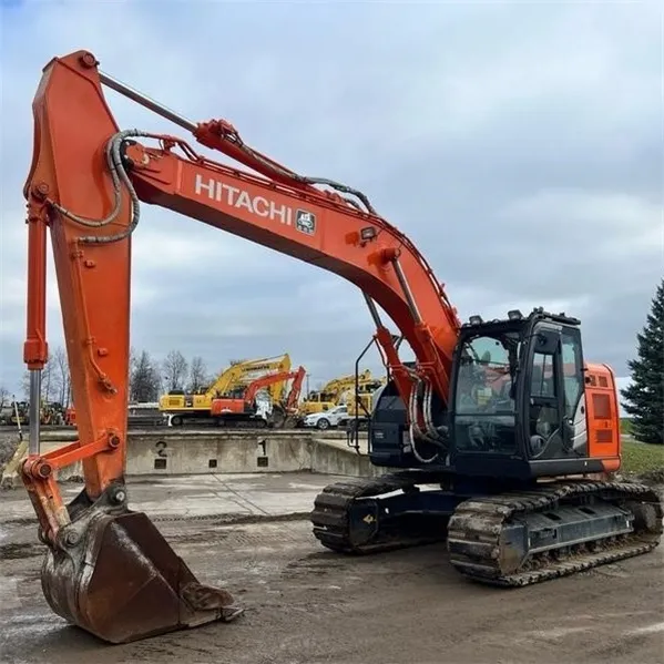 Used Hitachi EX225 ZX225 Excavator side view with boom fully extended, showing hydraulic arm and robust undercarriage