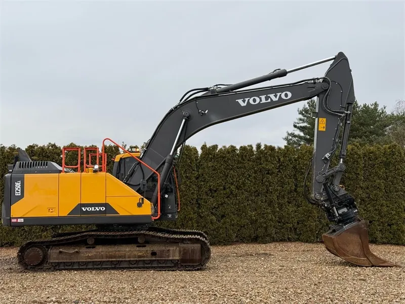 Volvo EC250 Excavator side view with arm extended, showing digging capabilities and undercarriage