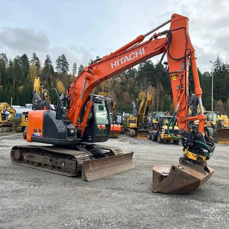Used Hitachi EX135 ZX135 Excavator side view with boom fully extended, showing hydraulic arm and compact structure