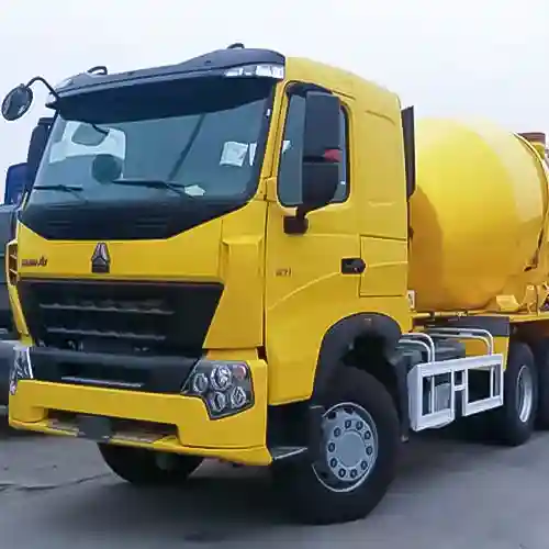Three-quarter angle view of Howo concrete mixer trucks, showing front cabin, mixing drum, and heavy-duty chassis