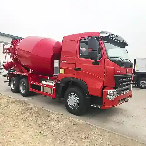 Side view of Howo concrete mixer trucks, showing long chassis and rotating cement drum