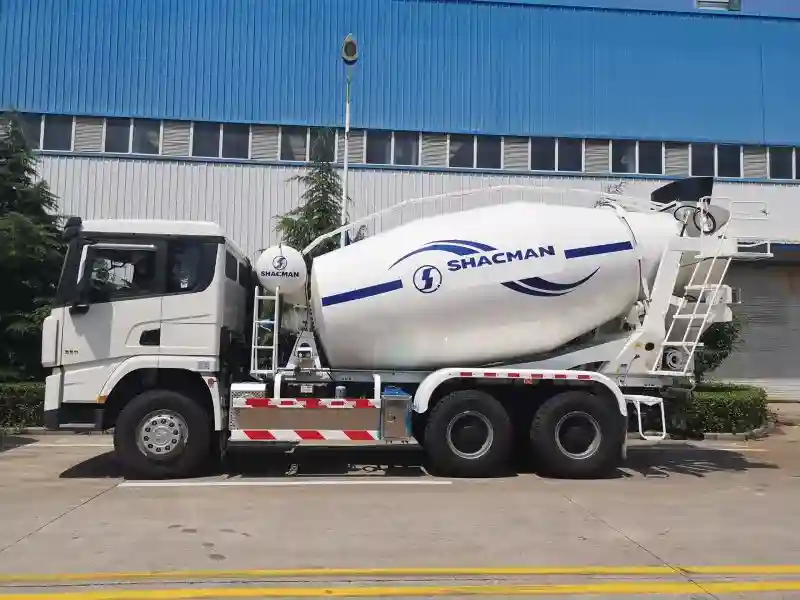 Side view of Shacman X3000 6x4 concrete mixer truck showing full chassis, rotating drum, and hydraulic system