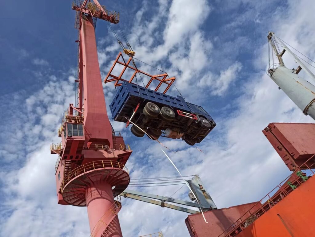 ZW Group dump trucks being loaded at the port for delivery to West Africa
