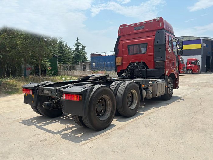 Used FAW J6P 460HP 6x4 Tractor Truck rear three-quarter view showing cabin, chassis, and rear axles for heavy-duty transport