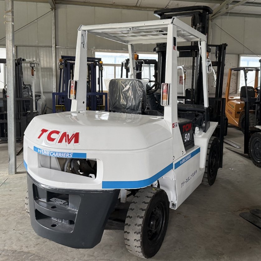 TCM FD50 forklift 3/4 view showing diesel engine and lifting mast