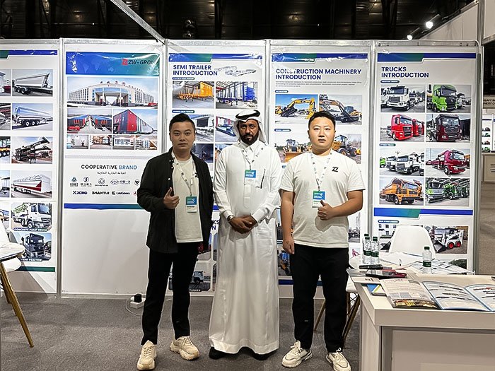 Clients visiting ZW Group booth at Saudi Arabia Industrial Exhibition 2025, inspecting construction machinery and trucks