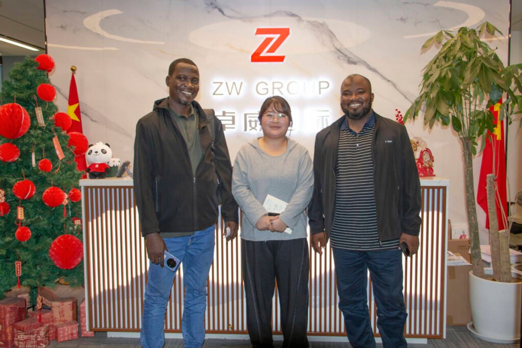 Nigerian clients inspecting 5 used HOWO NX dump trucks at ZW Group Vehicle factory