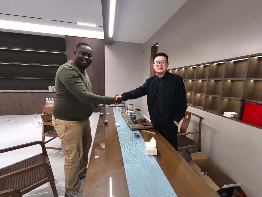 Congo clients shaking hands with ZW Group Vehicle CEO Ivan Sun after confirming orders