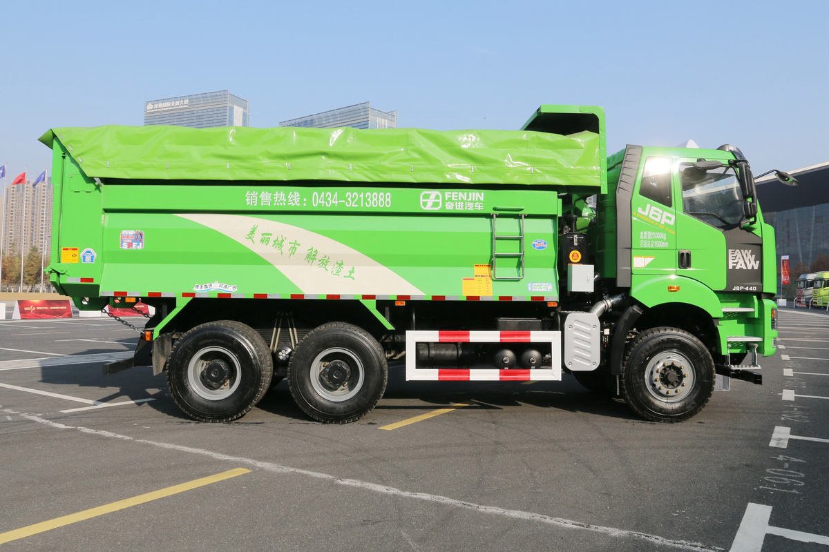 Side view of FAW J6P 6x4 440HP Dump Truck showing long wheelbase and reinforced dump body