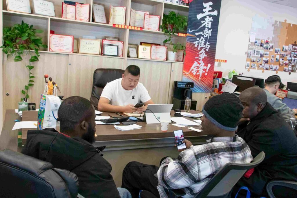 Nigerian clients discussing FAW tractor truck specifications with ZW Group sales team in the office