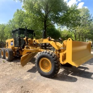 Brand new SEM 922F motor grader working on road construction, heavy-duty machine with 162kW engine in outdoor job site, front view.