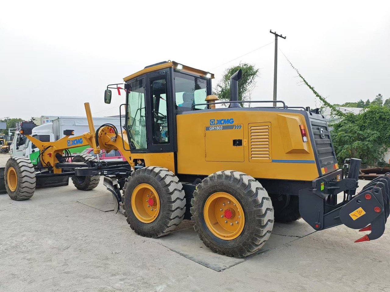 Rear three-quarter view of XCMG GR1803 motor grader showing rear structure and chassis