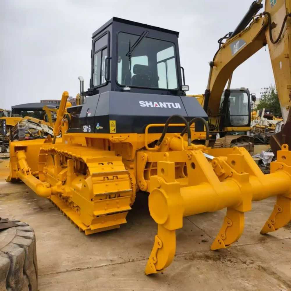 Brand New Shantui SD16 Bulldozer front three-quarter view showing blade, tracks, and powerful hydraulic structure on construction site