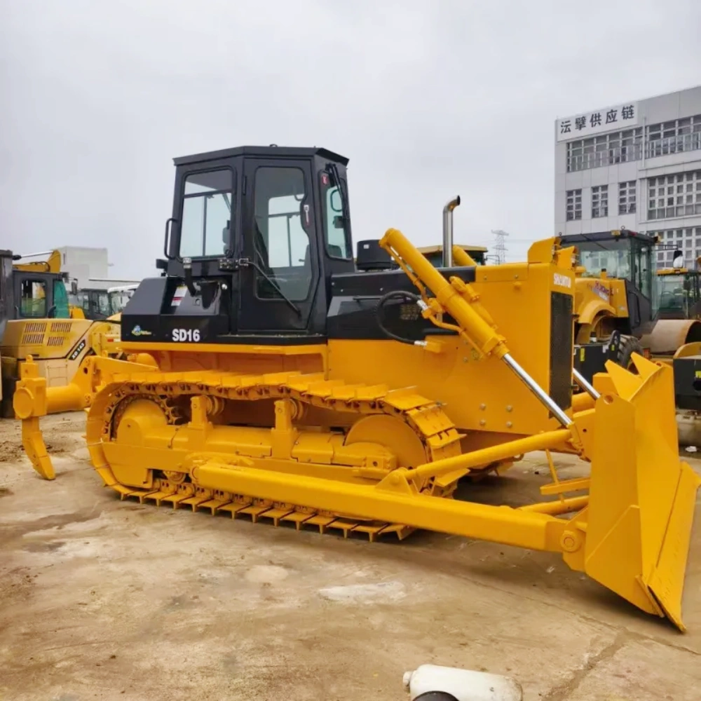 Brand New Shantui SD16 Bulldozer side view displaying crawler tracks, hydraulic system, and powerful engine structure