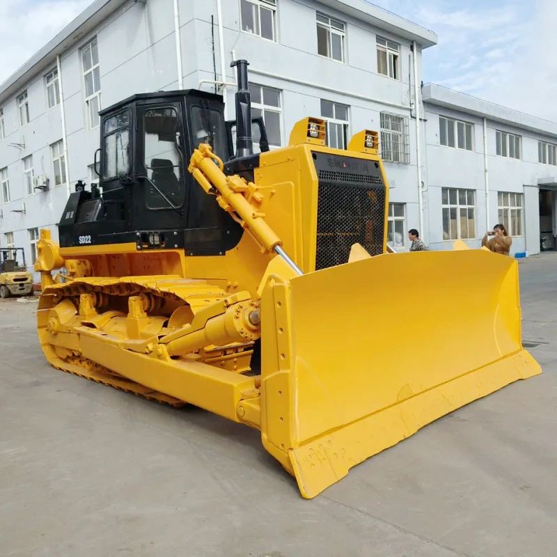 Front 3/4 view of Shantui SD22 bulldozer showing angled blade, crawler tracks, and heavy-duty structure for earthmoving and construction