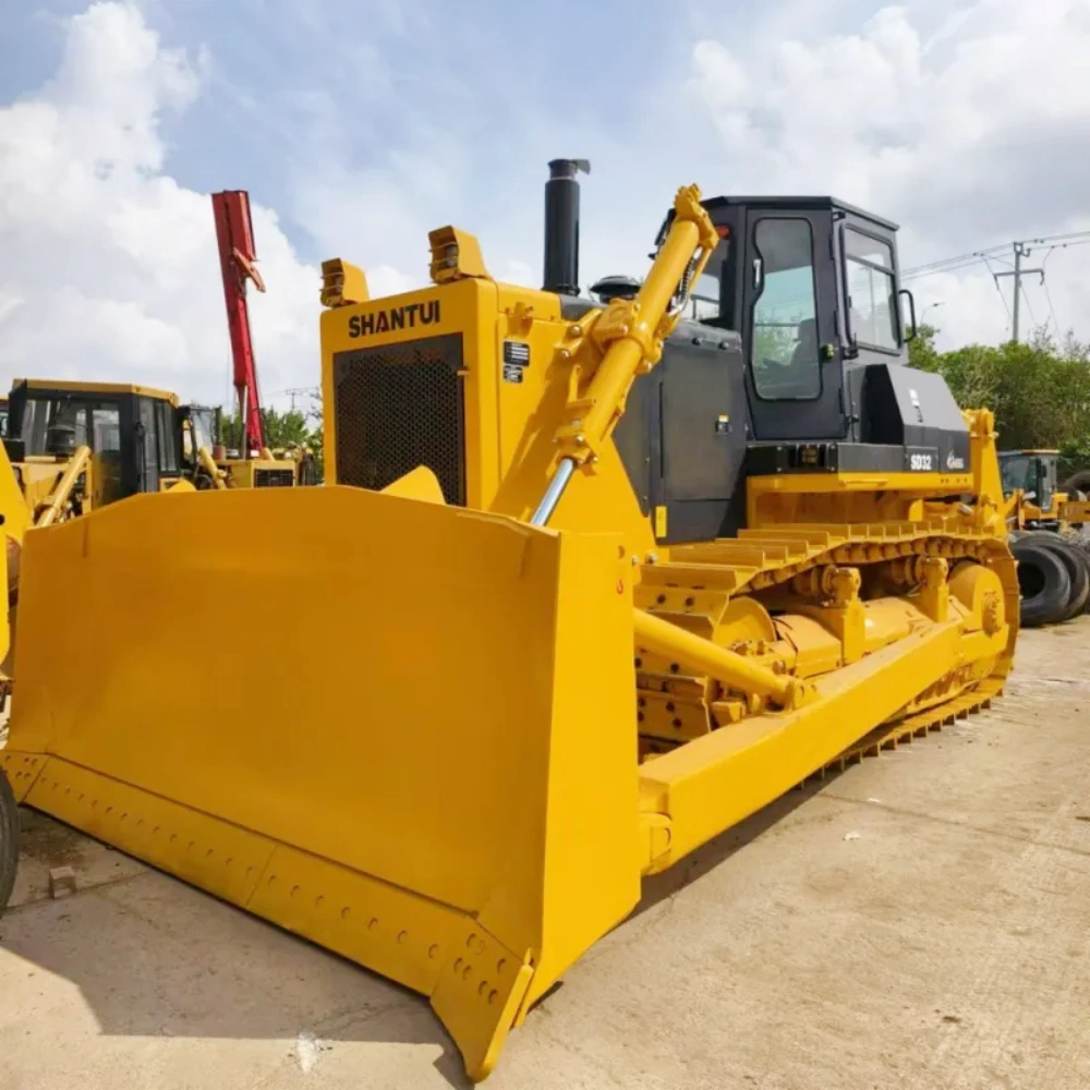 Front three-quarter view of Shantui SD32 bulldozer displaying powerful blade, rugged frame, and heavy-duty crawler system